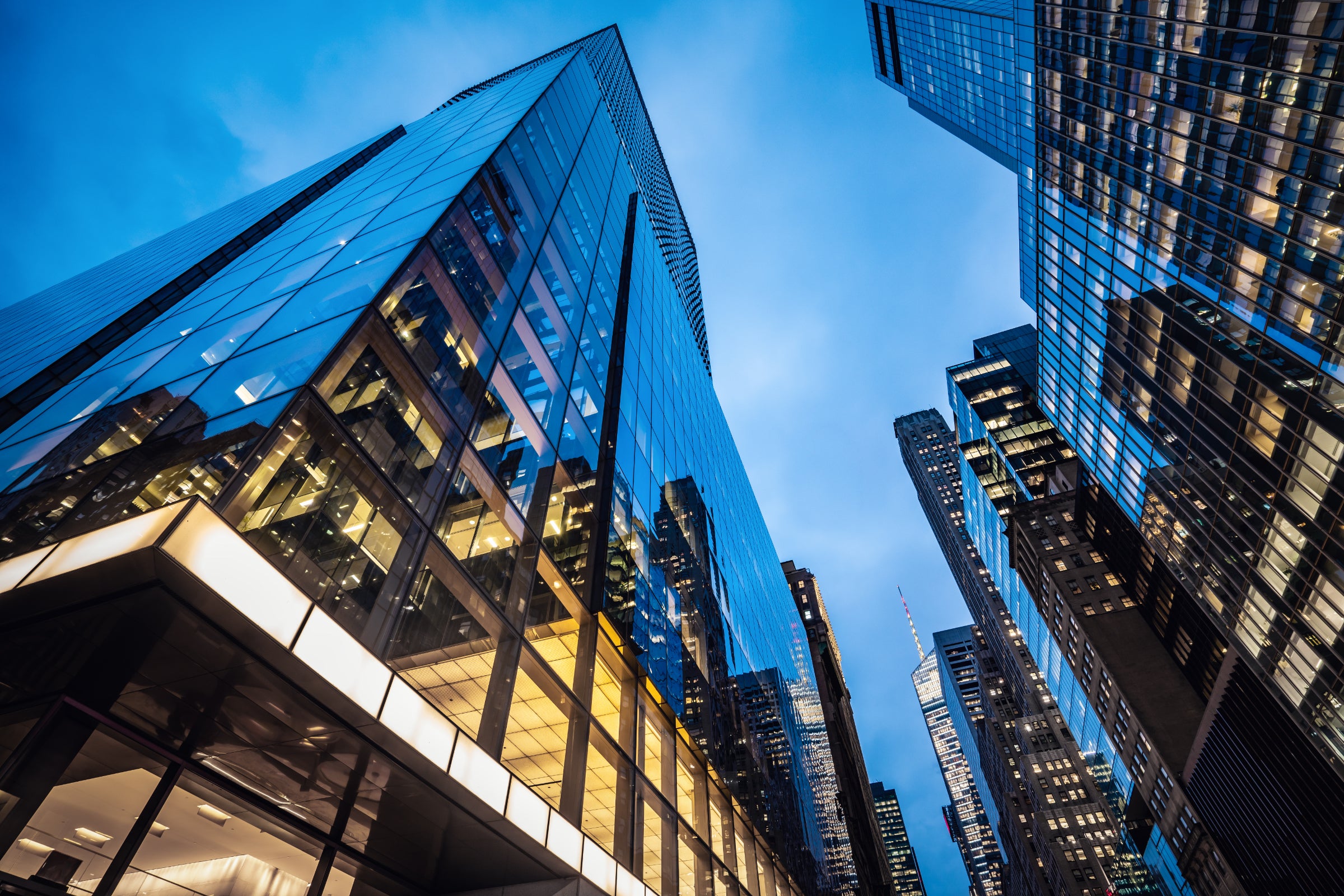 Skyscrapers at dusk, with lit offices