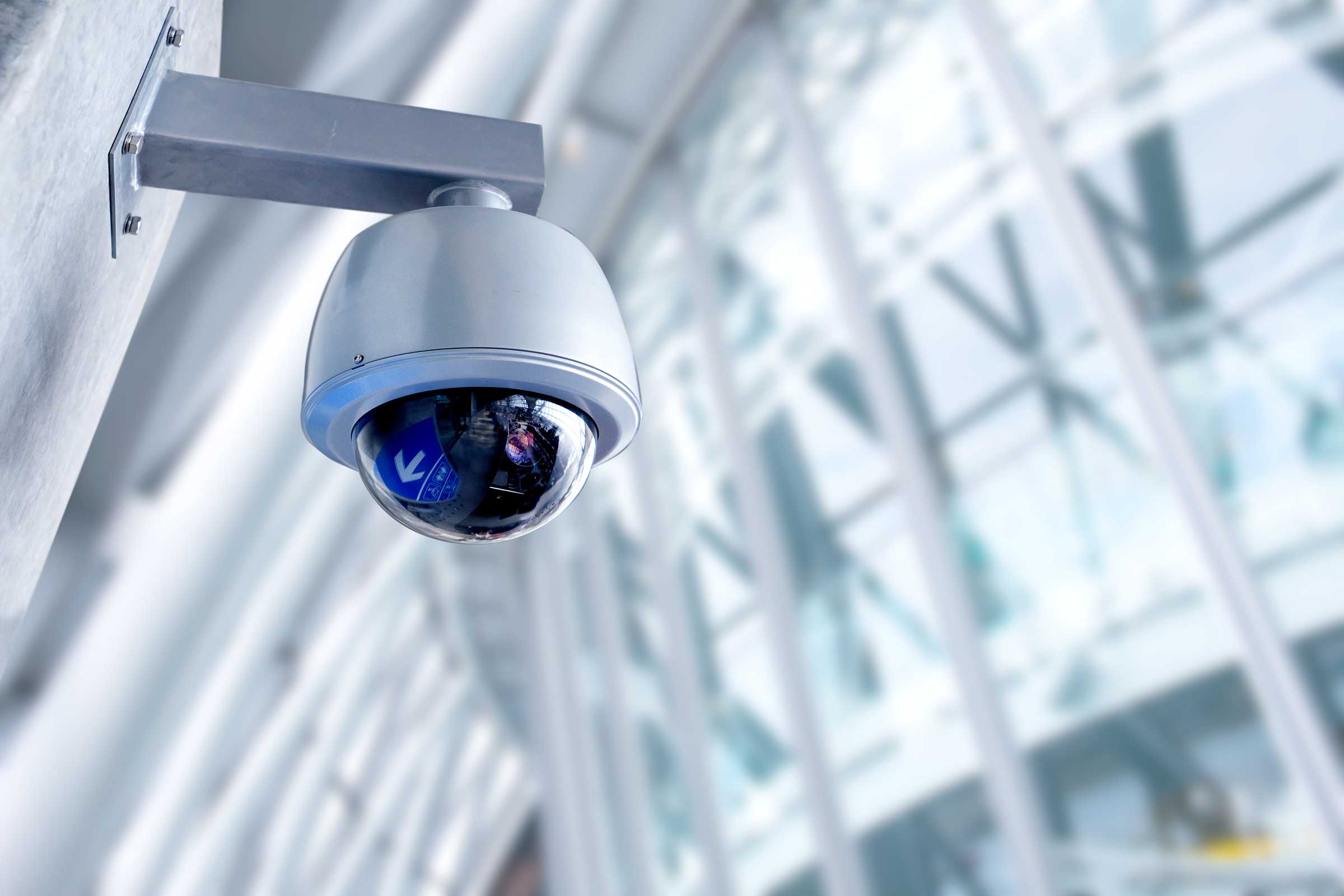 Security camera inside a modern white building