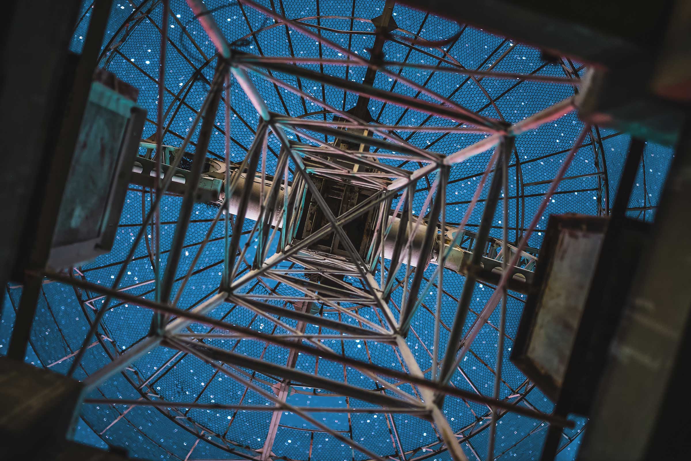 Looking at starry sky from below a radio telescope antenna
