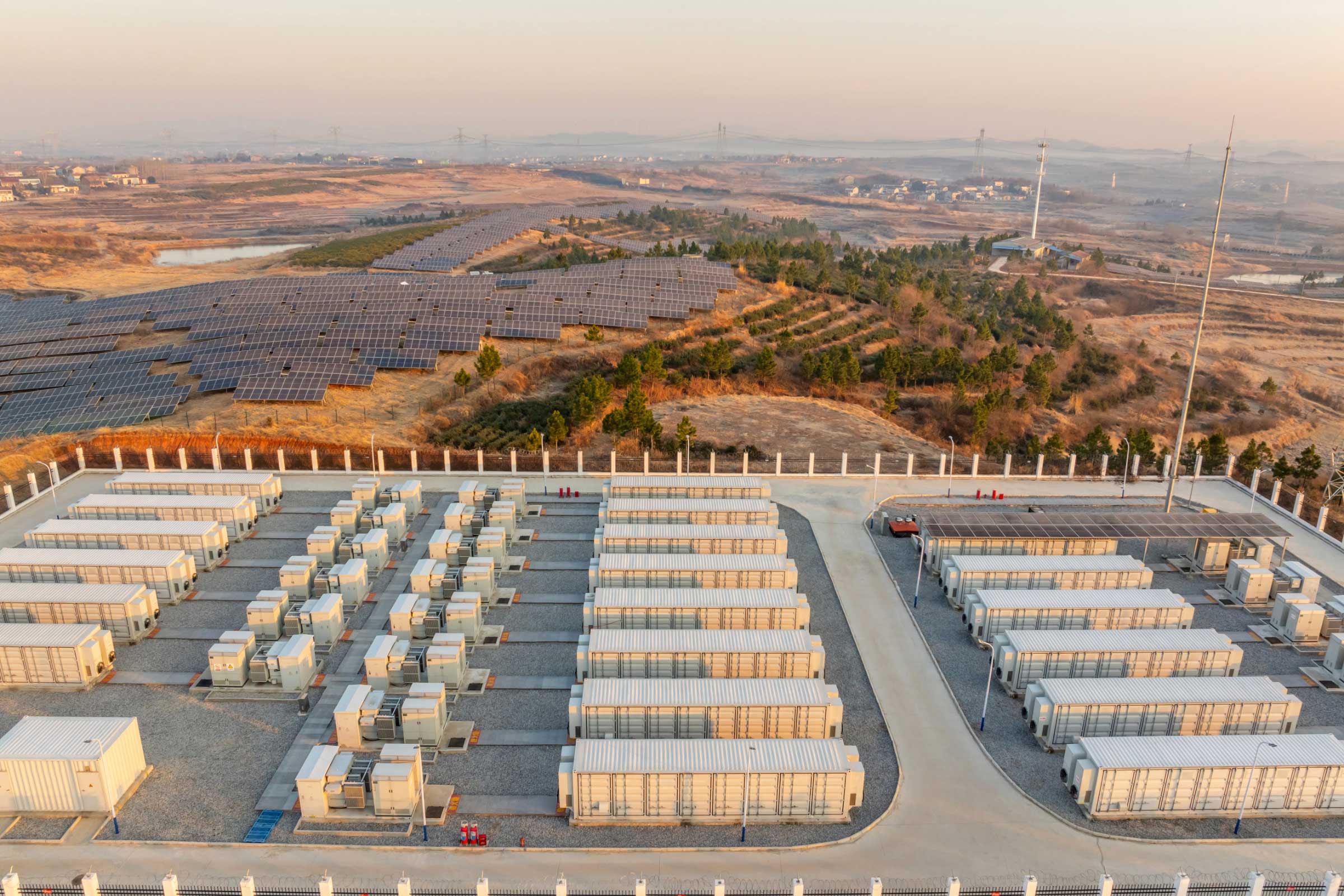 Overhead view of an energy power station next to a solar farm