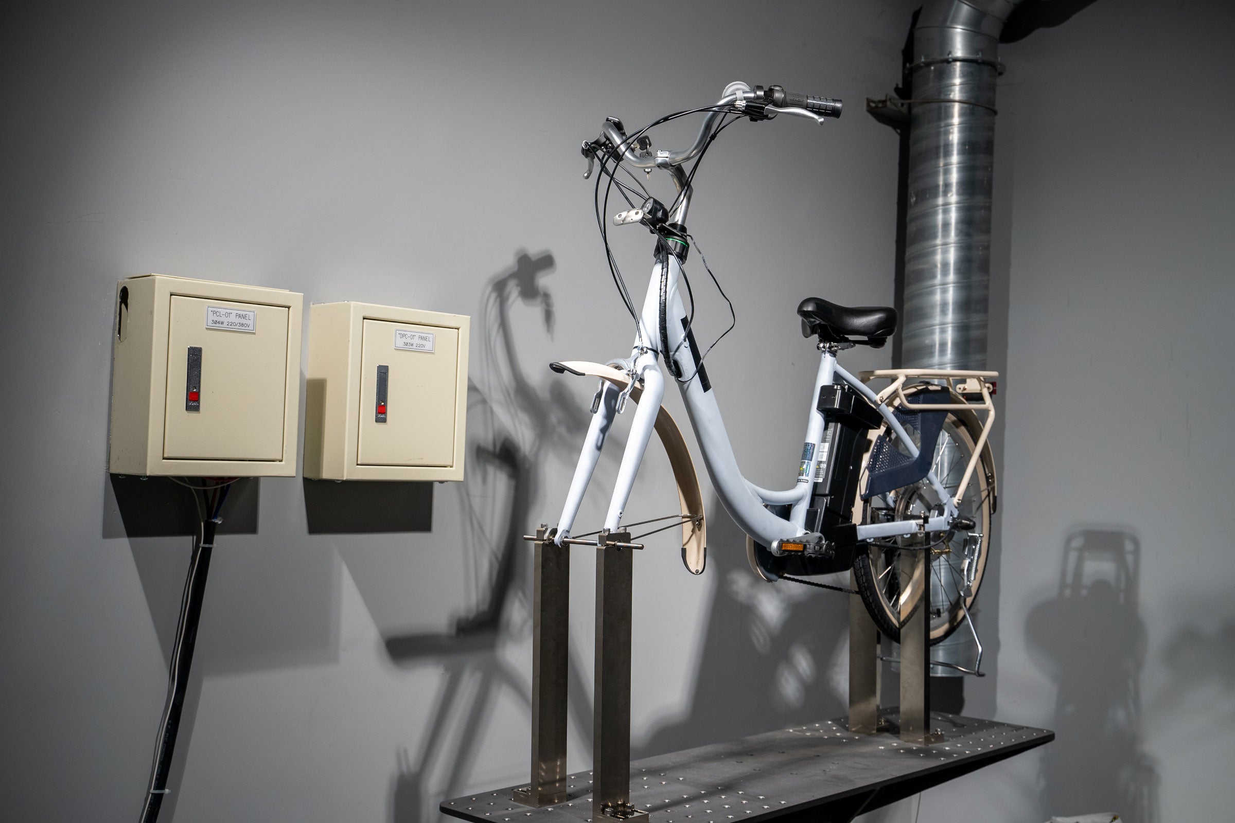 An electric bike charging at a station