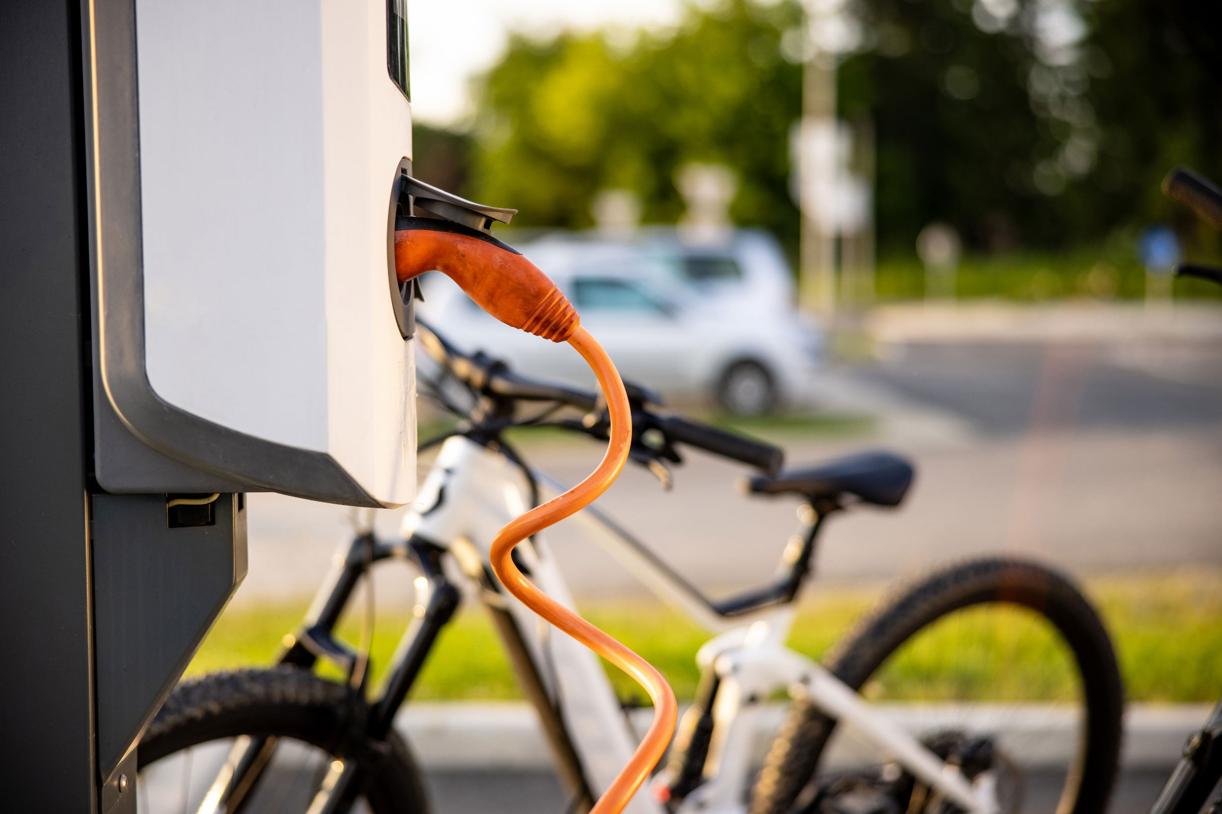 An electric car charging at a charging station