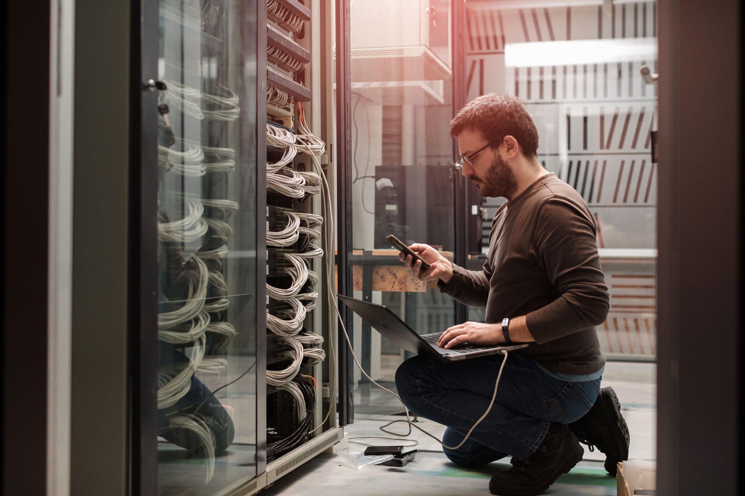 A person looking at cables