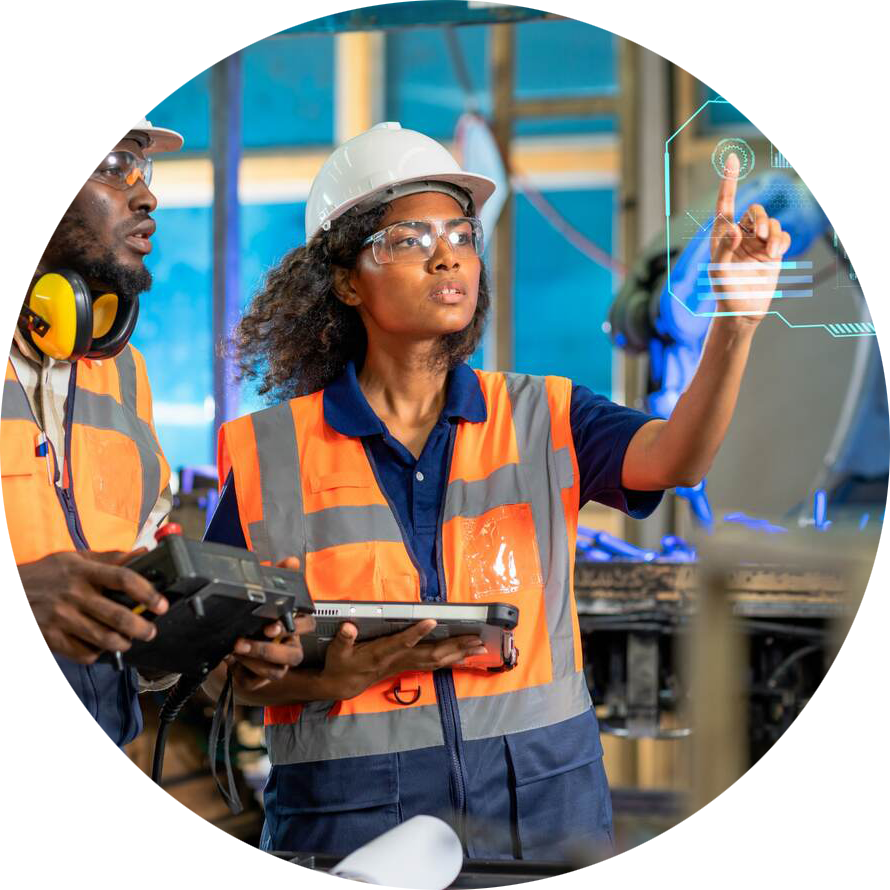 Engineer using tablet to check the robot system while her teamwork checks the security of the robot.