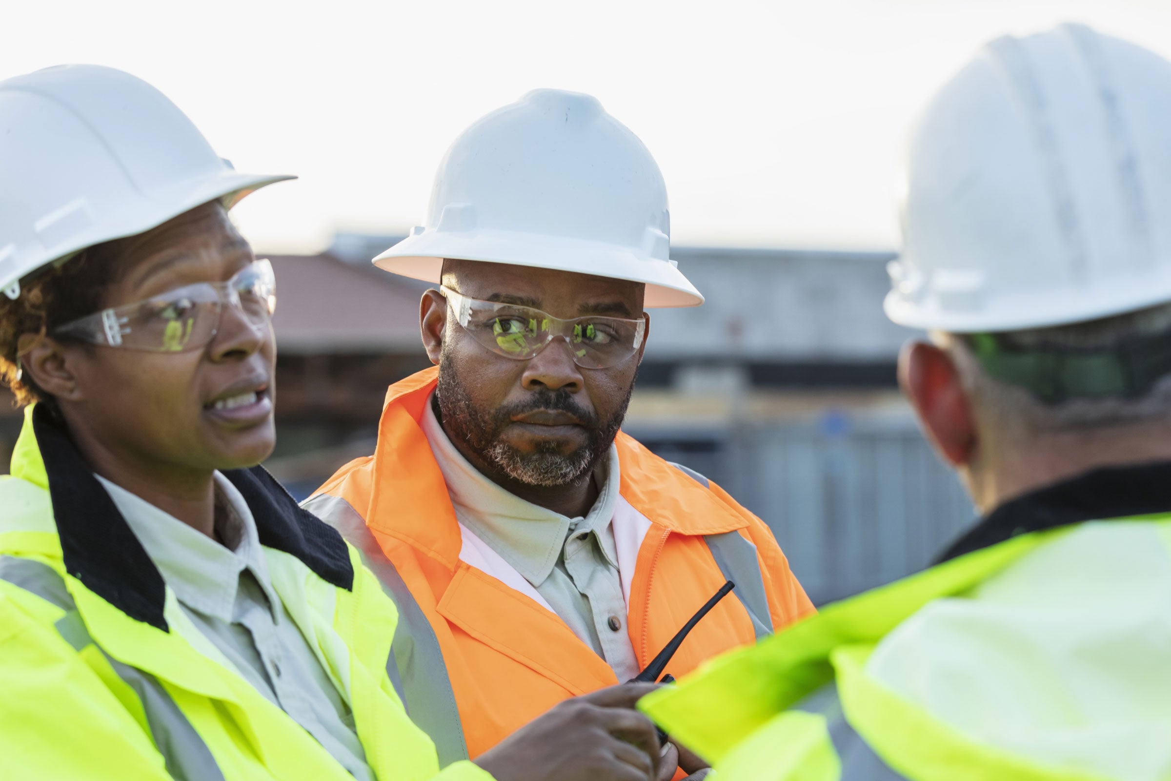 Three people discussing fire barrier management