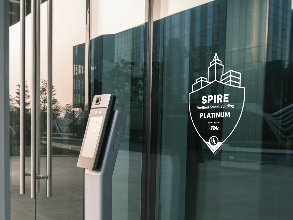 spire logo on glass window near a security checkpoint