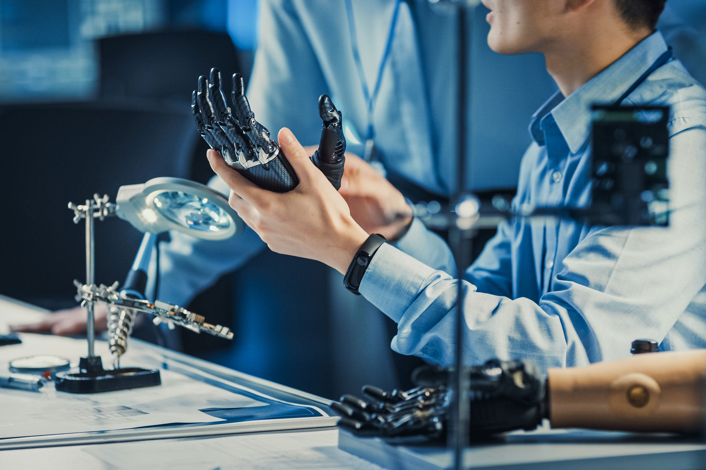 Engineer working on a robotic prosthetic arm