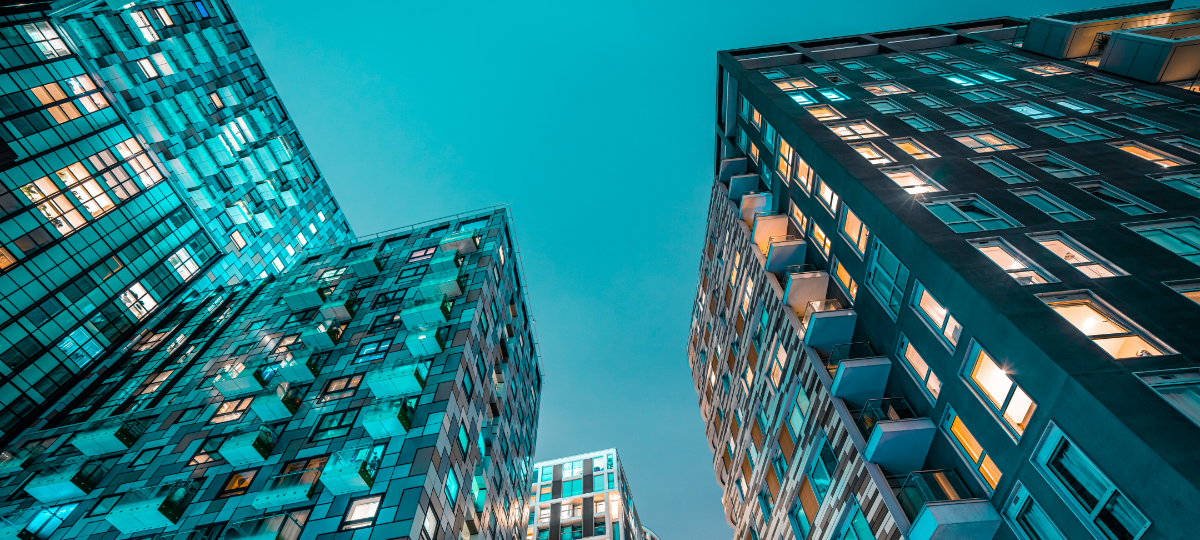 Lights in a high-rise apartment building at dusk