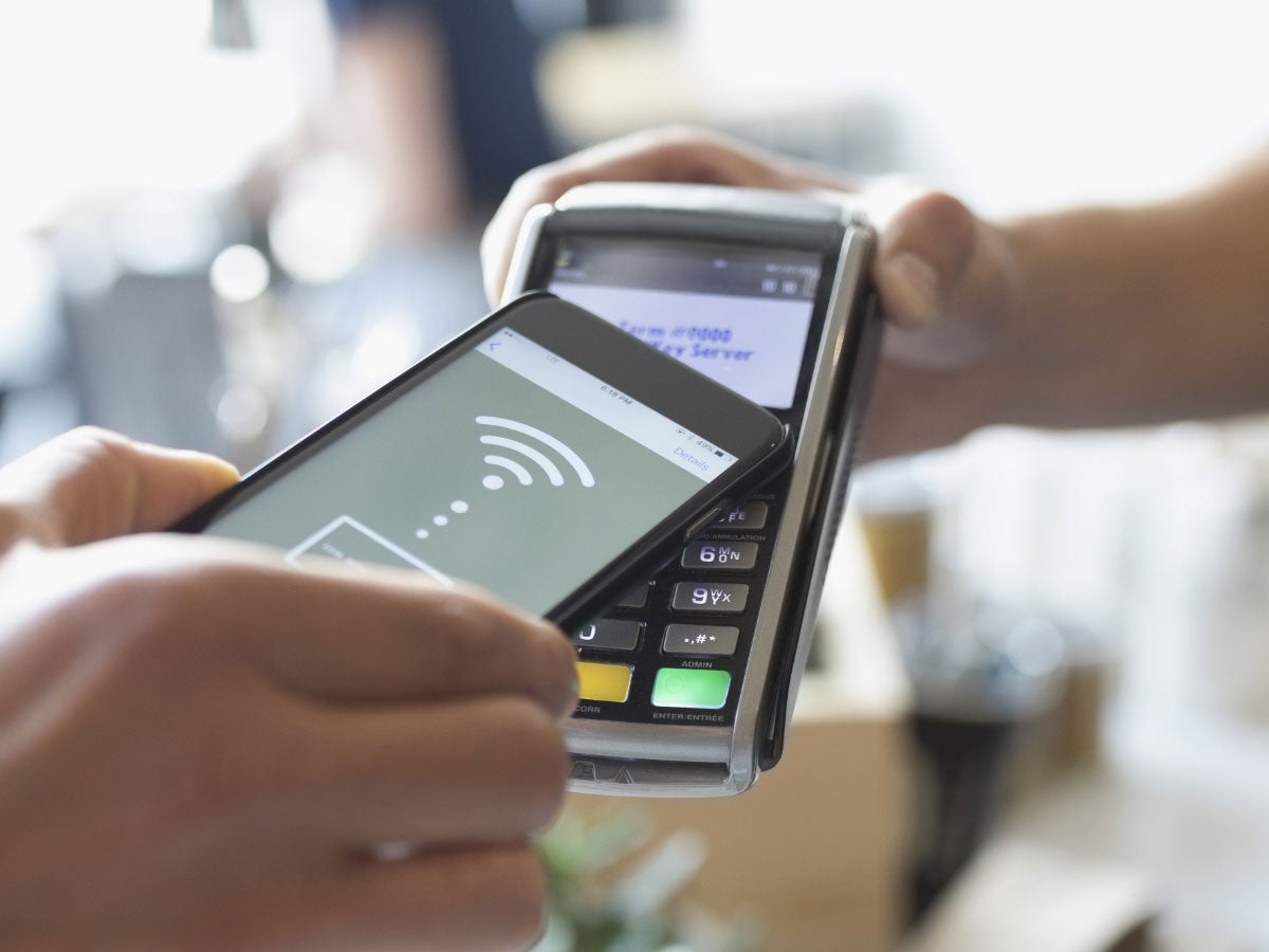Person paying with a smartphone