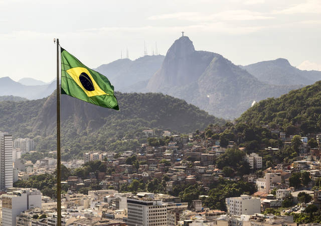 View of Brazil and waving Brazilian flag	