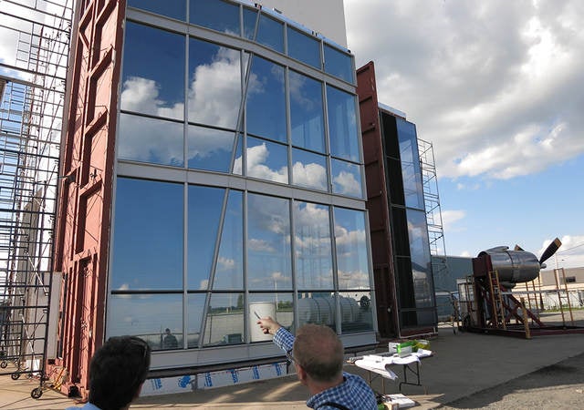 Contractors inspecting building