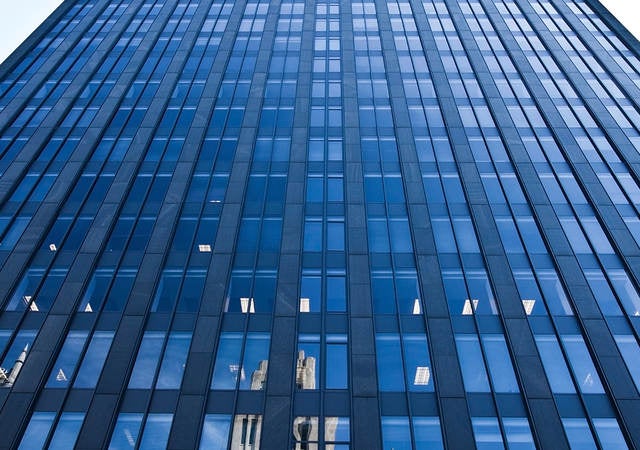 Looking up at a skyscraper. 