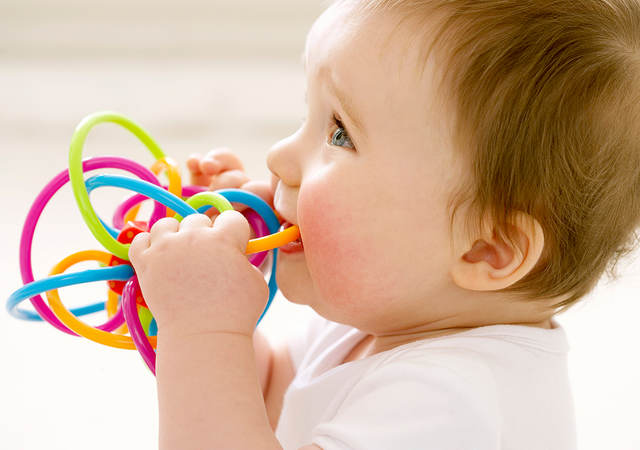 Baby playing with a teething toy 