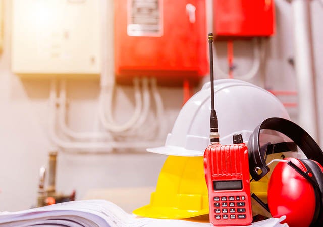 Standard construction safety equipment in a control room.