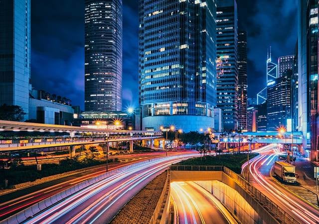 City at night with blurred cars