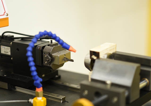 A lock cylinder being cycled to determine durability of the mechanism