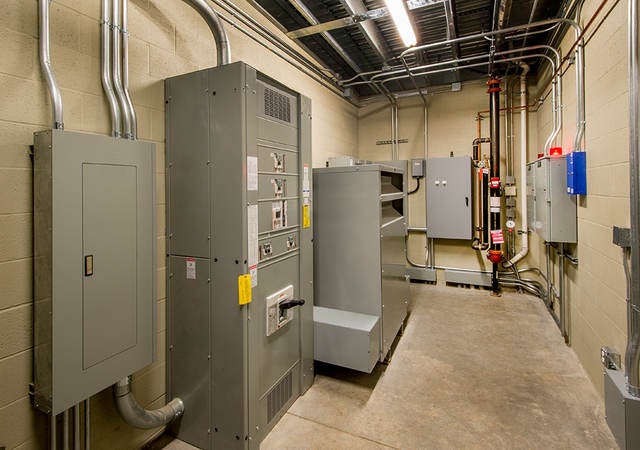 An electricalroom with circuit breakers.