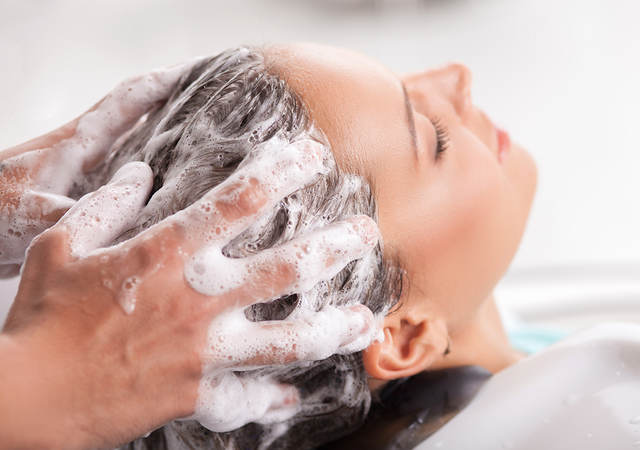 Woman’s hair being shampooed