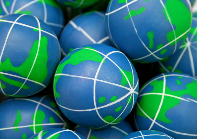 Close-up of squishy balls that look like the Earth. 