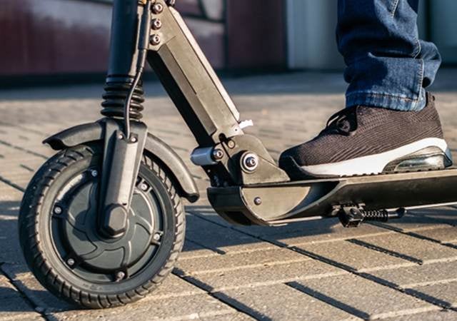 A child riding a scooter