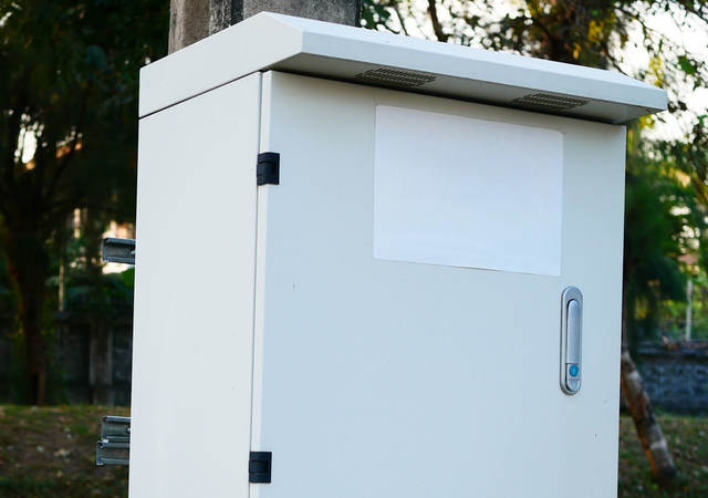 White junction box on post