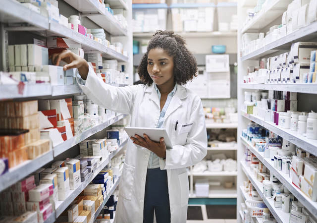 pharmacist with a tablet