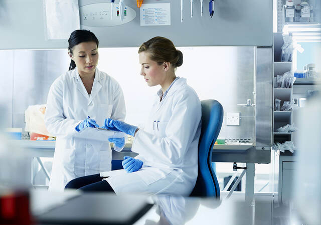 Two scientists in a lab working