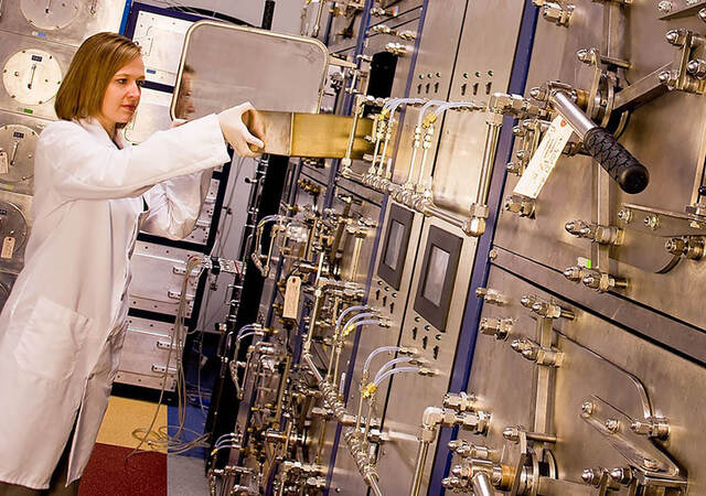 Female scientist working with equipment