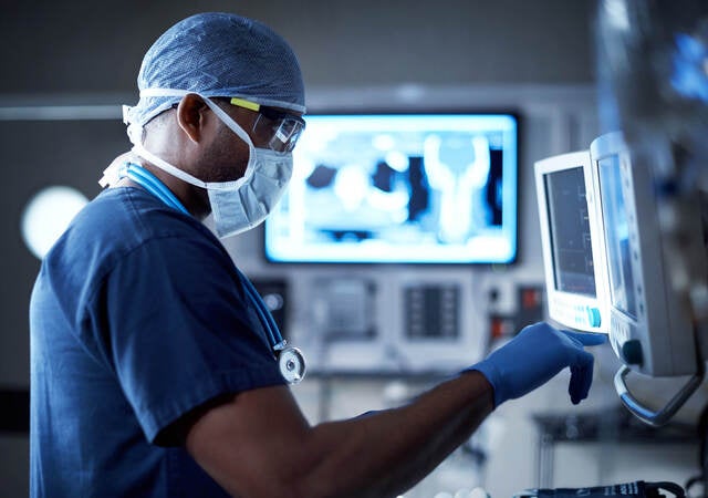 surgeon monitoring vitals