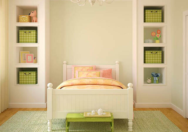 Child’s bedroom with bed and bookshelves