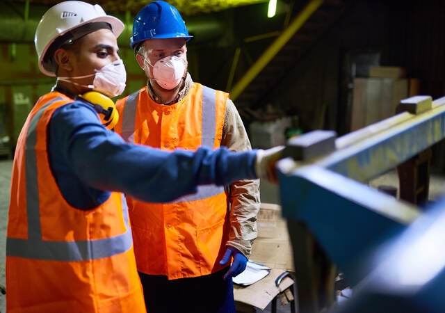 Factory working wearing PPE