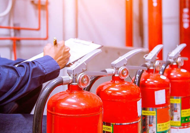 Photo of Engineer checking Industrial fire control system