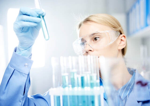 Photo of young woman working in laboratory