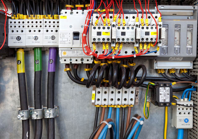 Electrical panel at a assembly line factory. Controls and switches