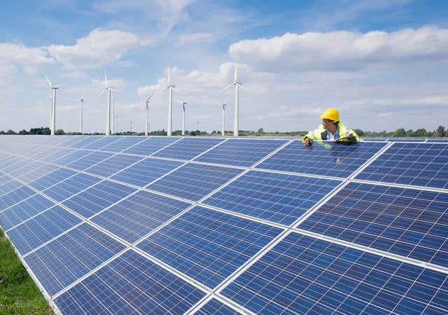 Man checking on solar panels