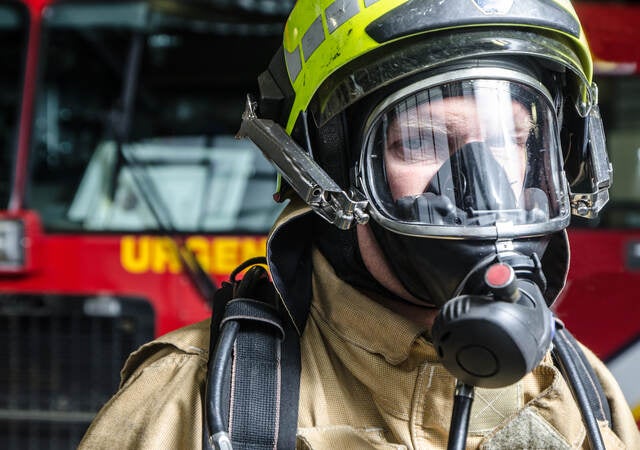 Fireman with breathing mask close up