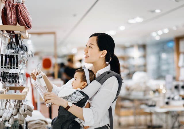 Asian women with baby shopping at department store