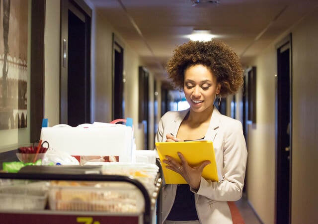 Woman doctor viewing charts in the hospital