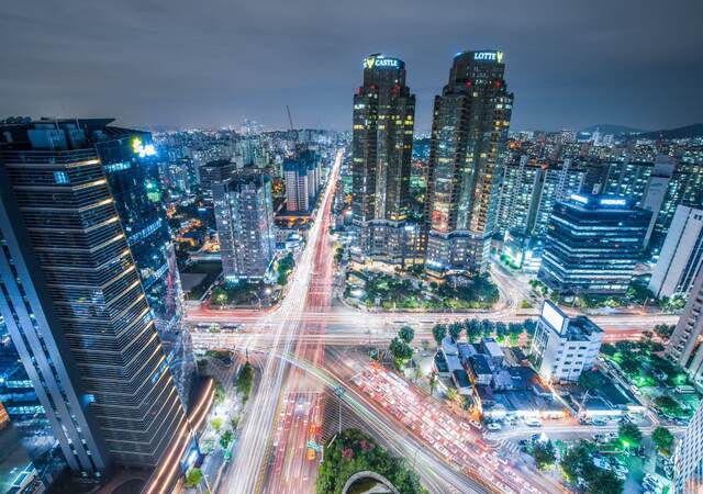 High Angle View Of Cityscape Lit Up At Night