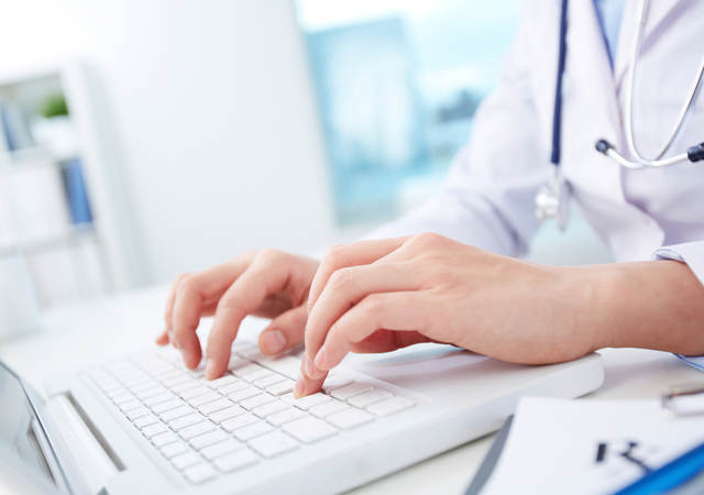 Medical professional typing