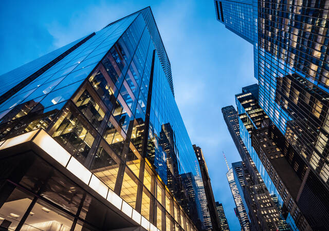  Skyscrapers at dusk, with lit offices