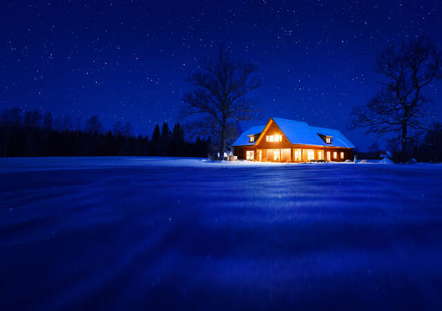 Residential home, lit up at night