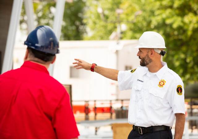 Two code authorities talking outdoors