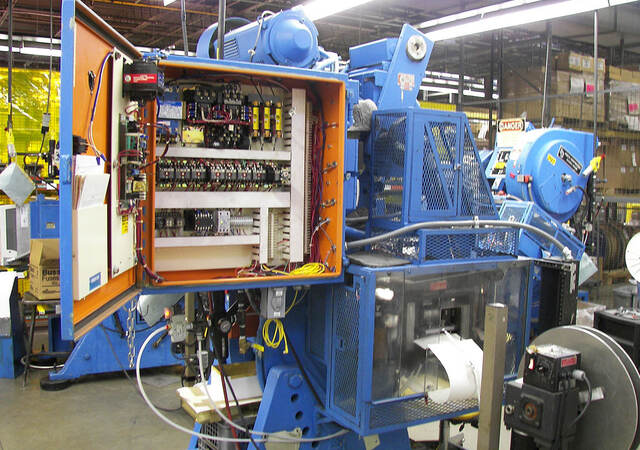 Industrial machinery with open control panel