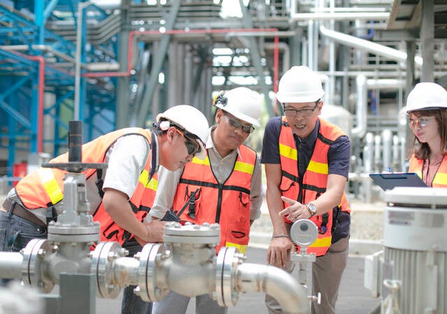 Safety personnel conducting equipment inspection