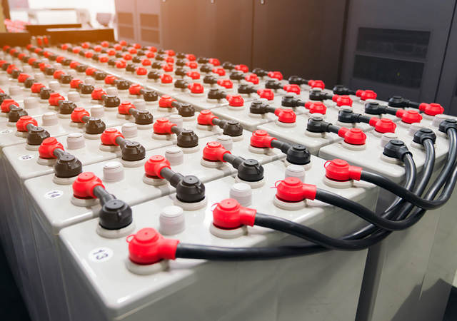 Rows of battery packs in industrial backup power system