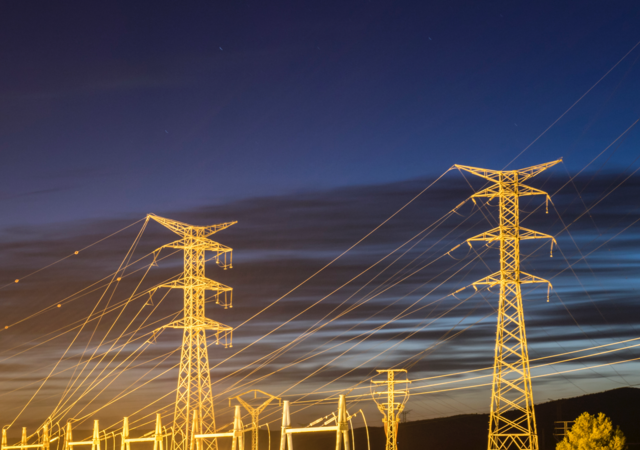 Electricity pylons at sunset