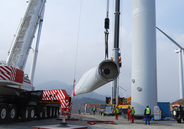 Workers doing wind turbine maintenance 