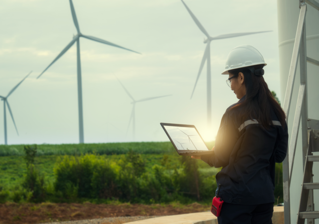 Technician testing wind turbines