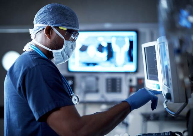 Surgeon looking at a monitor in an operating room